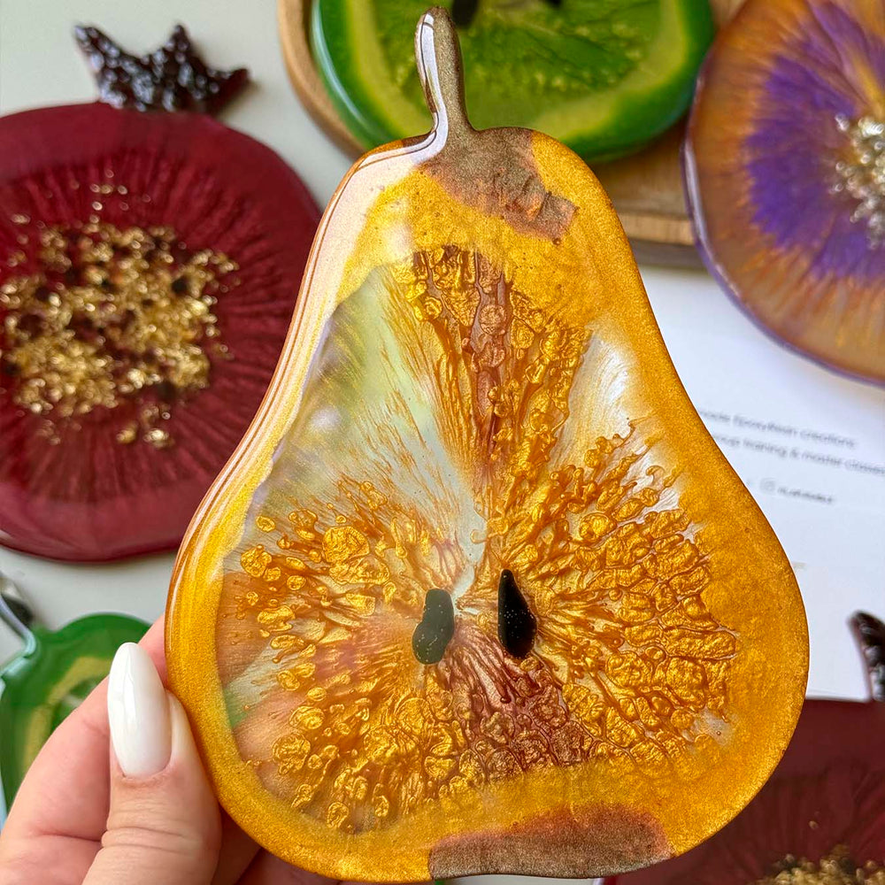 Fruit-shaped epoxy resin coasters made by workshop participants 15