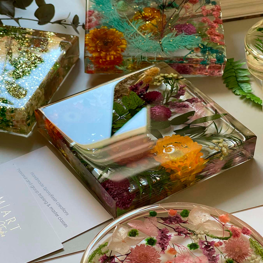 Epoxy resin lamps with dried flowers made by participants 3