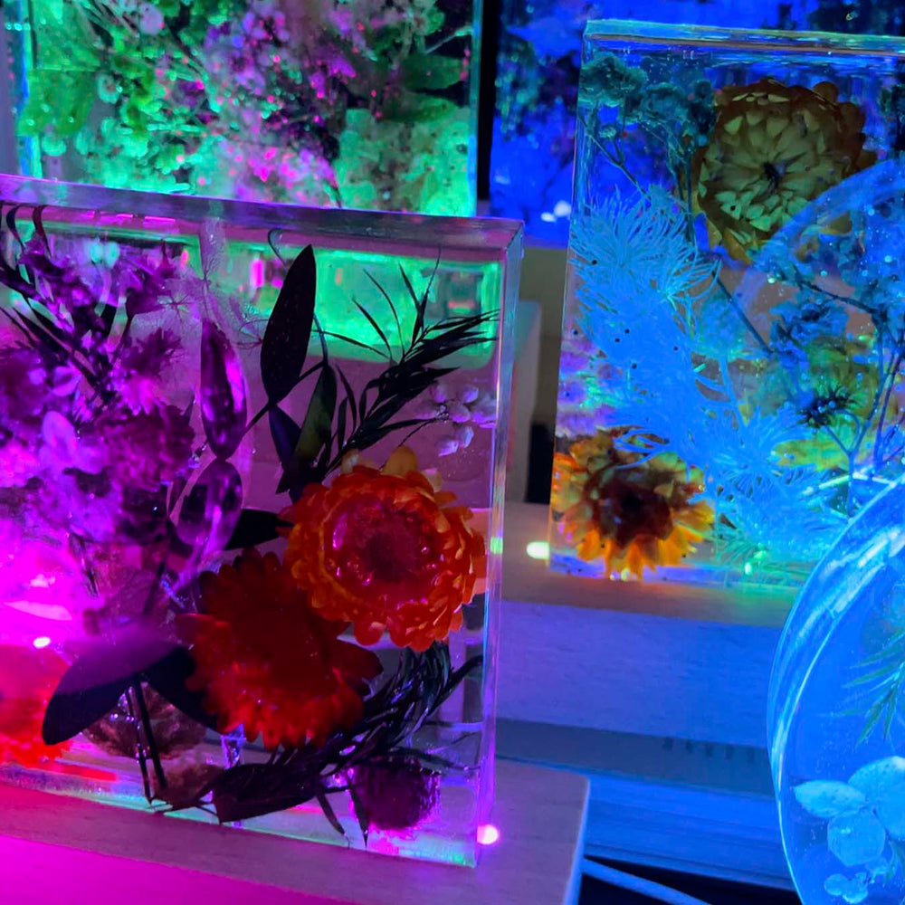 Epoxy resin lamps with dried flowers made by participants 11