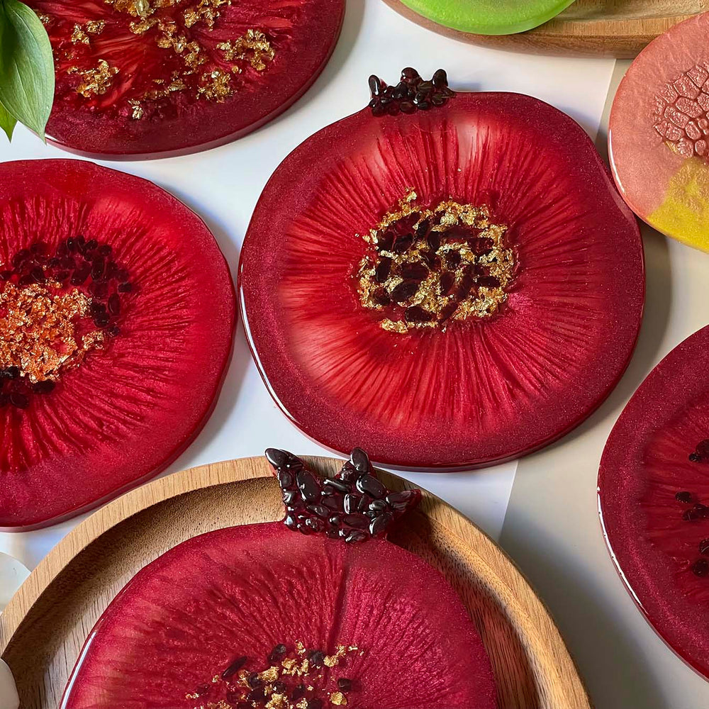 Fruit-shaped epoxy resin coasters made by workshop participants 2
