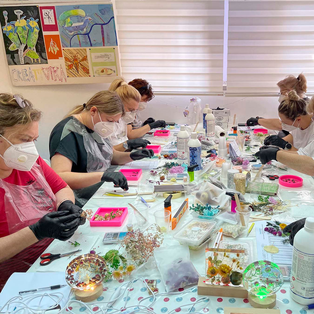 Epoxy resin lamps with dried flowers made by participants 7
