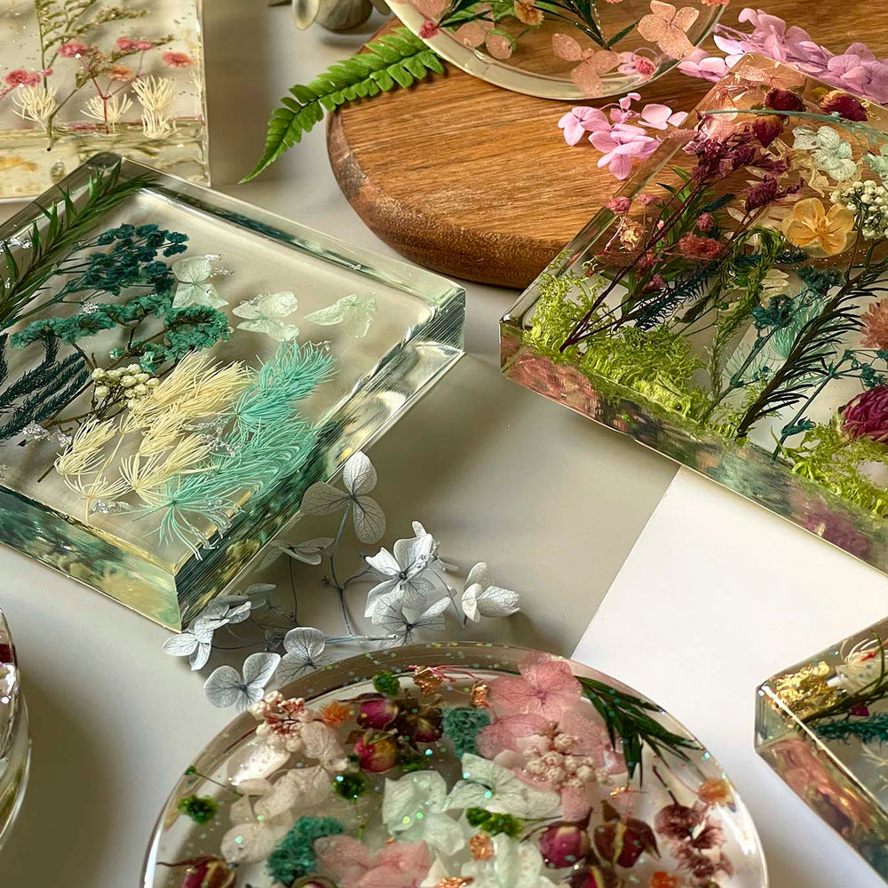 Epoxy resin lamps with dried flowers made by participants 13