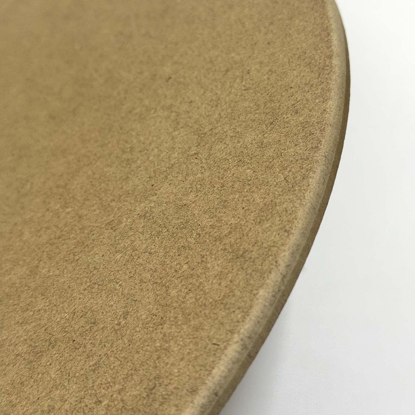 Close-up of a round, beige stone coaster on a white background thumbnail - 2